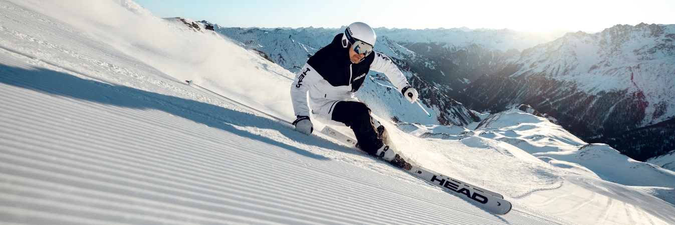HEAD Skier with Black and White Suit on a perfect slope