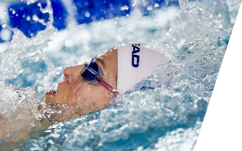 Woman who wears HEAD Swimming Team-Line Apparel in water